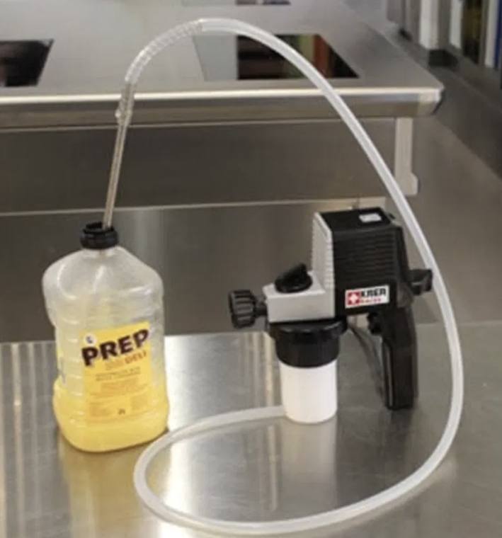 KREA sprayer drawing from a Prep release-agent container